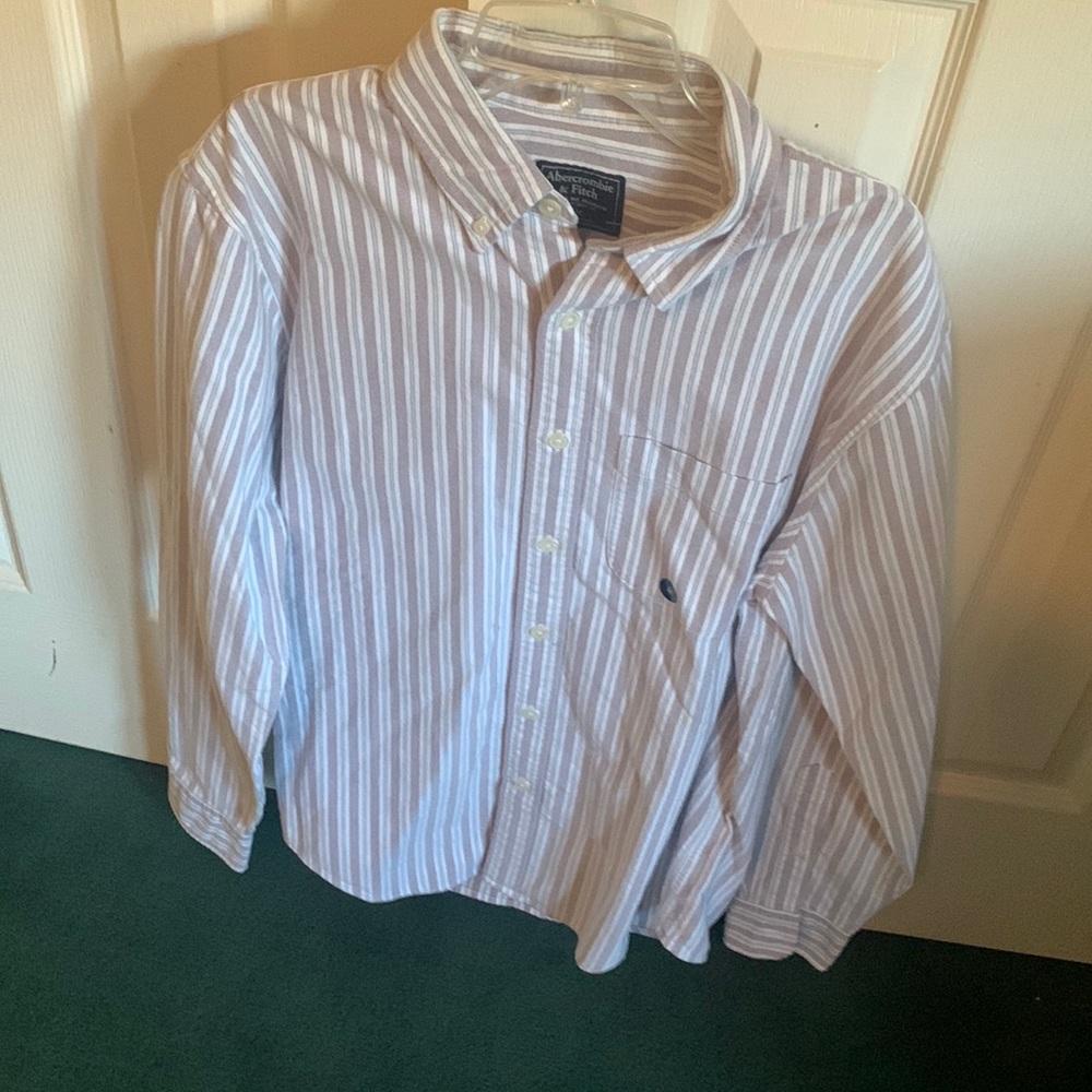 Men casual shirt. Light red in color of stripes with blue